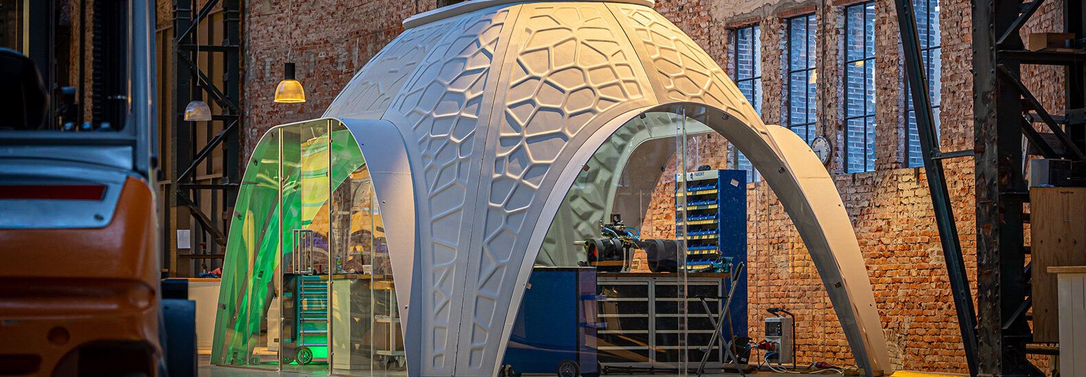 These custom, igloo-shaped workspaces are 3D-printed with recycled PET